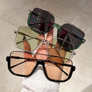 Detailed comparison of three square retro sunglasses in green, clear, and black frames