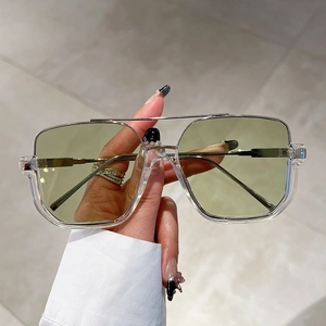 Fashionable oversized square sunglasses with light green lenses and a double-bridge frame