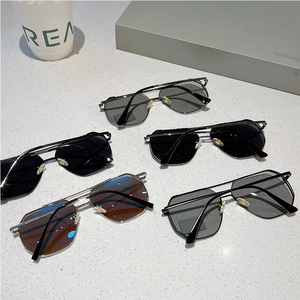 Detailed display of assorted vintage pilot sunglasses with slim metal frames and dual bridge
