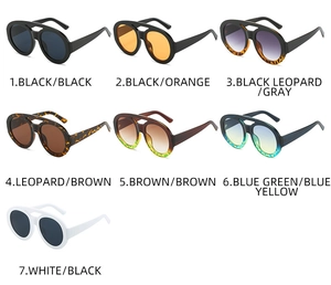 Collection of vintage oval double-bridge sunglasses in various colors on white background