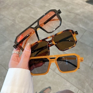 Three pairs of trendy square sunglasses in tortoiseshell and orange with double-bridge frame