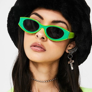 Y2K style bright green cat eye sunglasses with thick frames and dark lenses for women