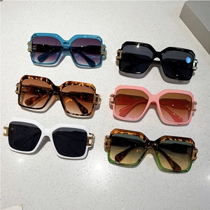 Detailed grid of six colorful square oversized sunglasses with gold metal hinge accents