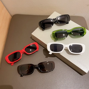 Detailed display of vintage rectangle sunglasses in black, green, white, red, and brown