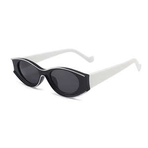 Modern cat eye sunglasses featuring black frames and white temples with dark lenses