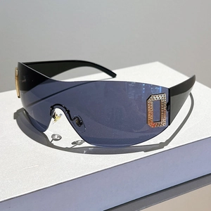 Y2K oversized aviator sunglasses with blue-grey lenses and golden diamond accents