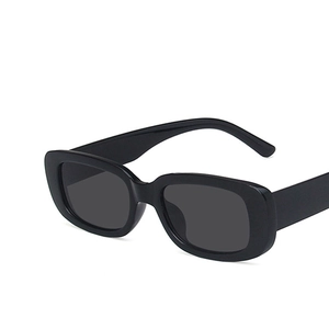 Retro rectangle black sunglasses with thick glossy frames and dark lenses at a 45-degree angle