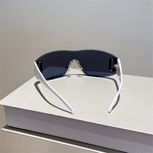 Y2K oversized wrap shield sunglasses with bold white frames and dark tinted lenses
