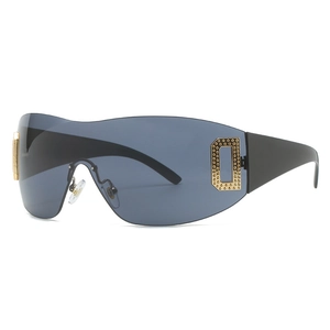 Futuristic shield sunglasses with dark grey one-piece lens and golden D-shaped metal inlay