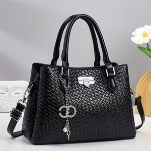 Elegant black woven texture handbag with diamond D pendant and adjustable shoulder strap