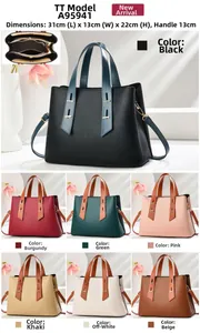 Detail of lychee pattern leather tote bag showing internal zipper and multi-layer storage