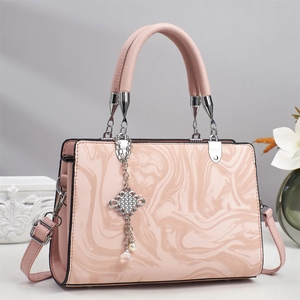 Elegant pink marble texture handbag with silver hardware and pearl tassel detail
