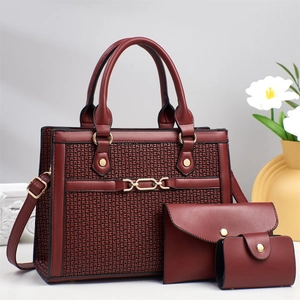 Three-piece burgundy composite handbag set with geometric texture and gold chain detail