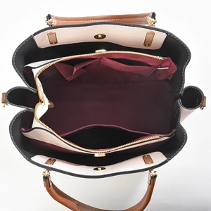 Top view of large tote bag with three compartments, lychee grain leather, and gold hardware