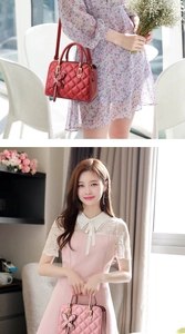 Detail of pink and red quilted crossbody bags with butterfly clasps in an elegant cafe setting
