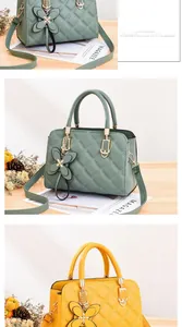Close-up of quilted leather handbags in sage green and yellow with golden hardware
