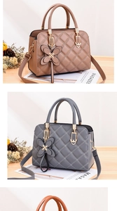 Close-up of quilted leather handbag featuring a 3D butterfly charm and adjustable strap