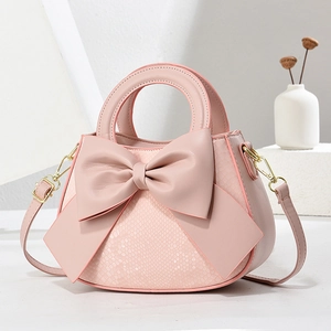 Sac à main rose en similicuir avec motif serpent, nœud et boucles dorées