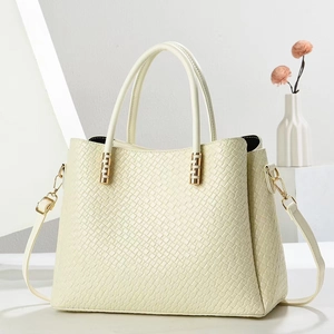 Elegant off-white vintage tote bag with crocodile texture and gold hardware details