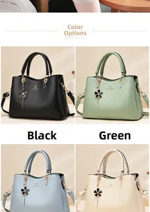 Detail view of large tote bags in black, green, blue and beige with flower charms