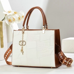 Elegant white crocodile pattern handbag with brown round handle and printed shoulder strap
