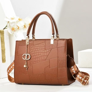 Brown crocodile pattern tote bag with geometric stitching and luxury wide strap