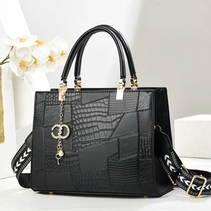 Black alligator texture tote bag with wide shoulder strap and gold pearl charm
