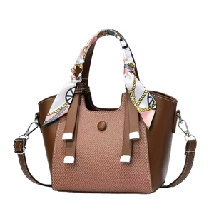 Vintage brown leather tote bag with pink twill fabric and decorative handle silk scarf