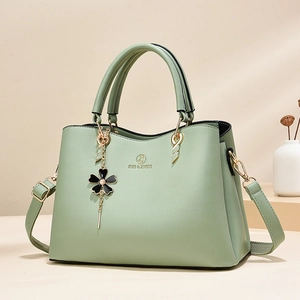 Mint green luxury tote bag with lychee pattern leather and gold hardware detail