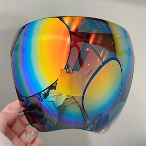 Macro detail of rainbow coated face shield showing the colorful lens and K-ONE logo