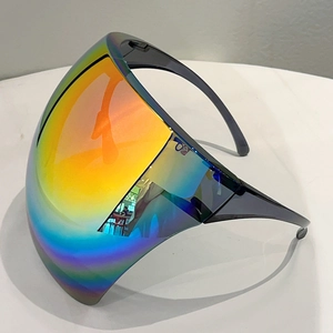 Close-up of rainbow gradient lens and black frame on a futuristic protective shield visor