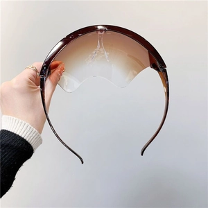 Macro detail of gradient brown anti-fog face shield lens with integrated nose pad