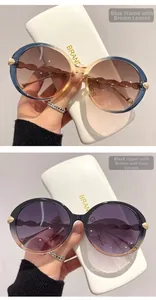 Detail of round oversized sunglasses with gold leaf decor and gradient lenses