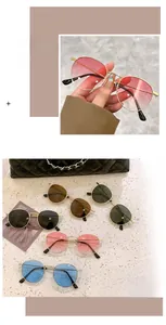 Detailed views of small round frame metal sunglasses in five gradient color lens options