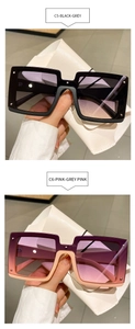 Detail view of large rectangular sunglasses with C5 black and C6 purple gradient frames