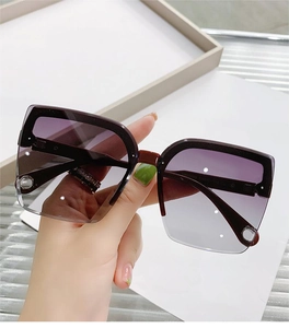 Close-up of rimless sunglasses with gradient purple lenses and model number Y88003 on temple