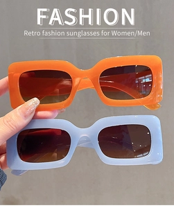 Detail view of modern retro square sunglasses in jelly orange and light blue frames