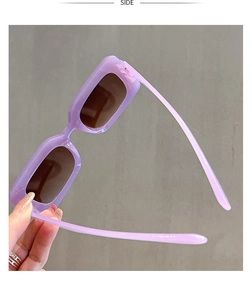 Side view of trendy purple rectangular sunglasses featuring thick translucent frames