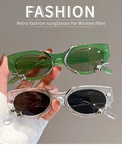Detail of retro snake-inspired metal accents on green and clear fashion sunglasses