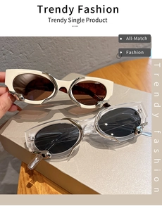 Detail of cat-eye sunglasses with silver liquid metal accents and stylish wide temples