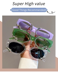 Detailed view of rectangle sunglasses with vintage silver metallic floral patterns on frame