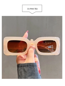 Detailed close-up of C6-PINK-TEA rectangle sunglasses with translucent tea pink frames
