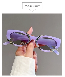 Detail view of purple rectangle sunglasses featuring silver snake metal accent on temple