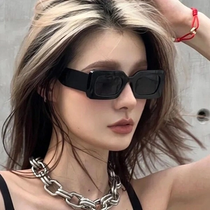 Modern retro rectangle sunglasses for women with thick black frames and dark lenses