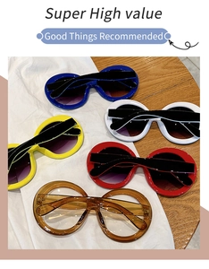 Flat lay of retro oversized round sunglasses in blue white yellow and tortoiseshell colors