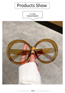 Side view of oversized round transparent tan sunglasses with premium acetate finish