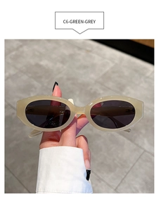 Detailed shot of cream oval sunglasses with dark lenses and thick frame, style C6-GREEN-GREY