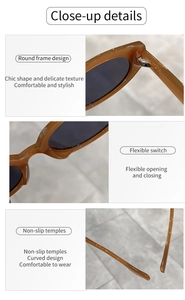 Detail of vintage oval sunglasses showing metal hinges and curved anti-slip temples