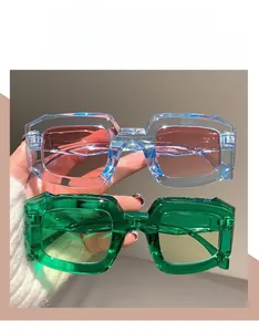 Detail of irregular candy color sunglasses with translucent frames and gradient lenses