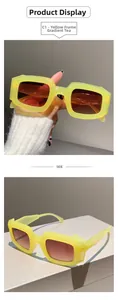 Detail view of rectangular yellow transparent sunglasses with gradient brown lenses